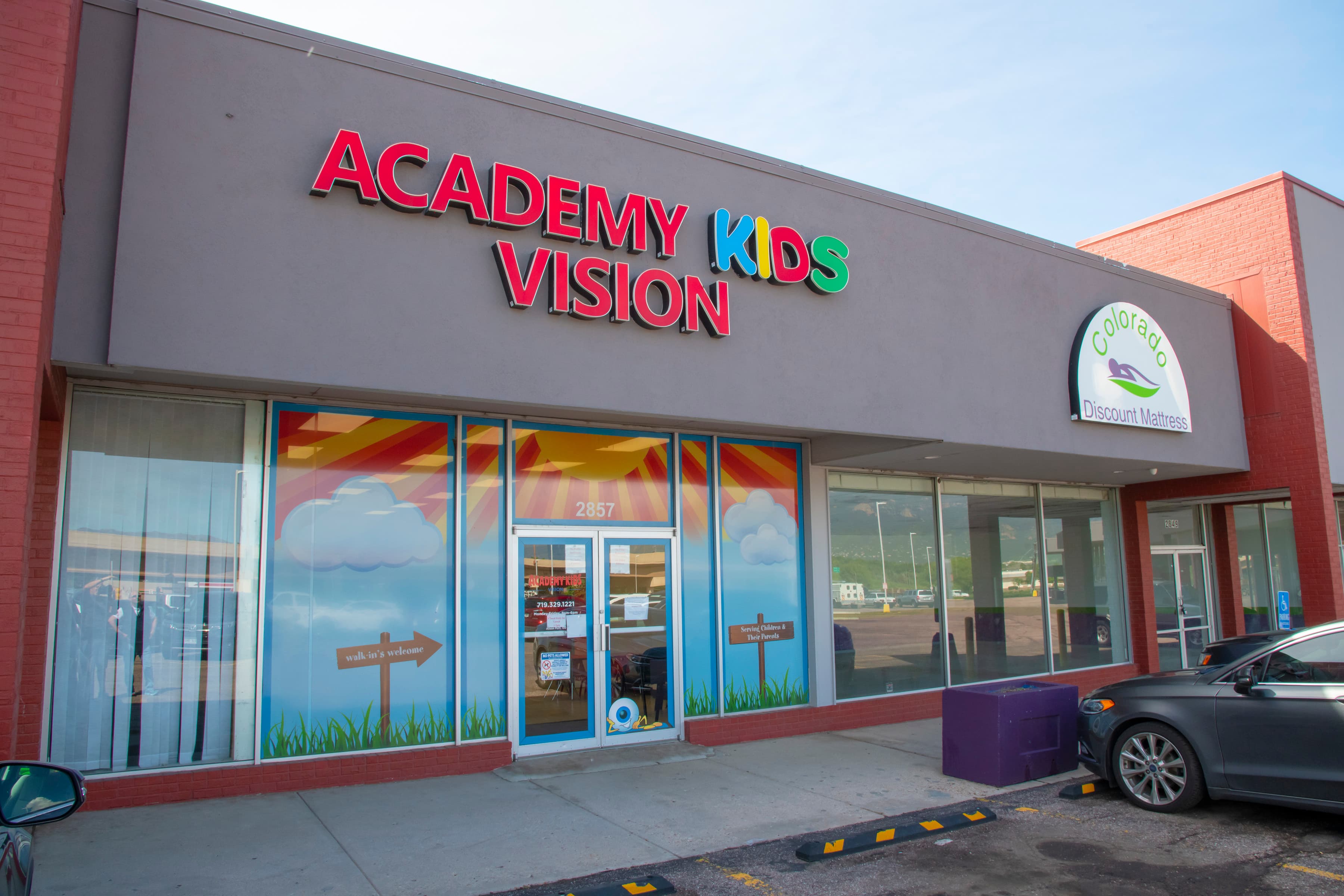 sign outside of a kid's optometrist office that says Academy Kids Vision