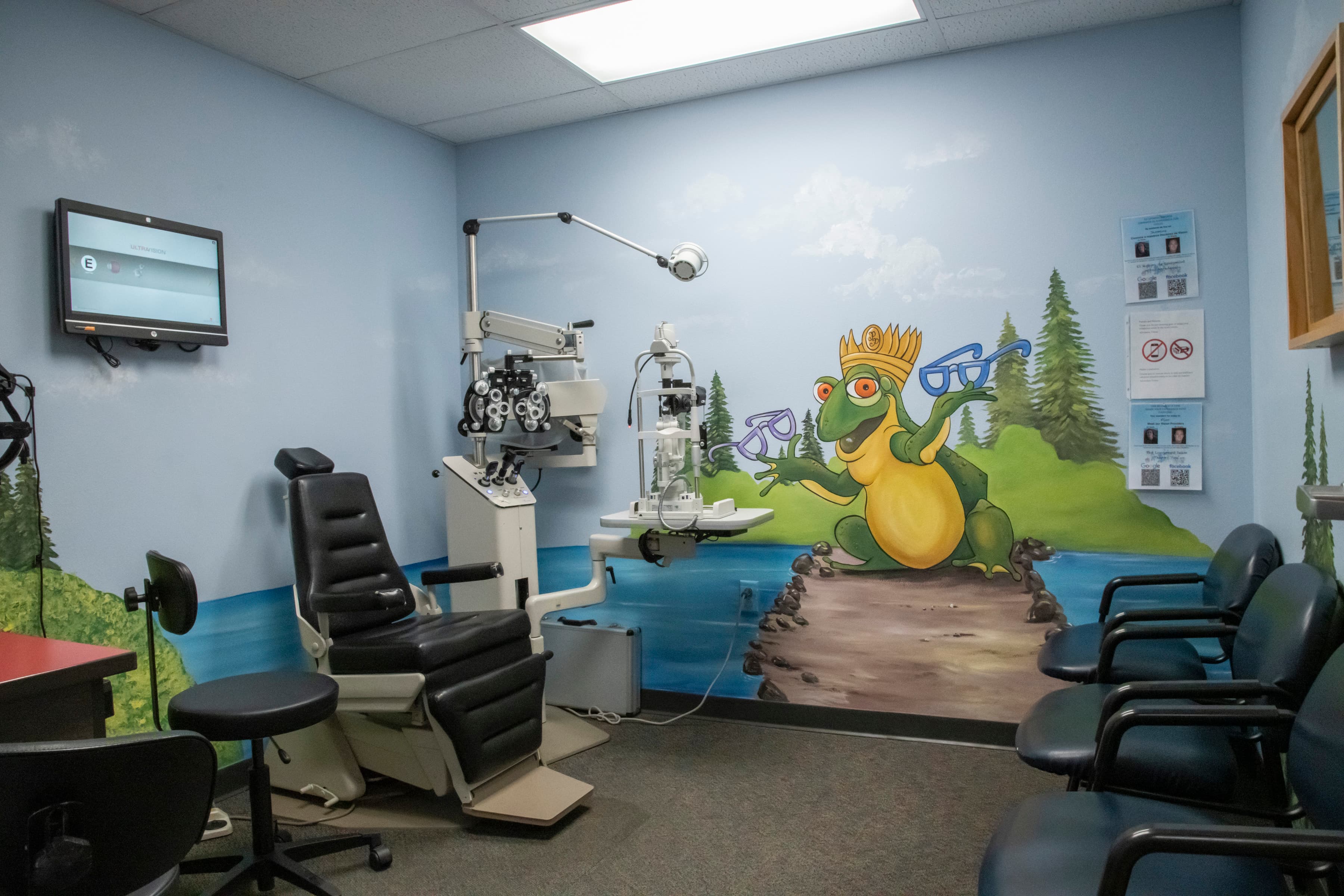 chidlren's eye exam room with graphics on a wall