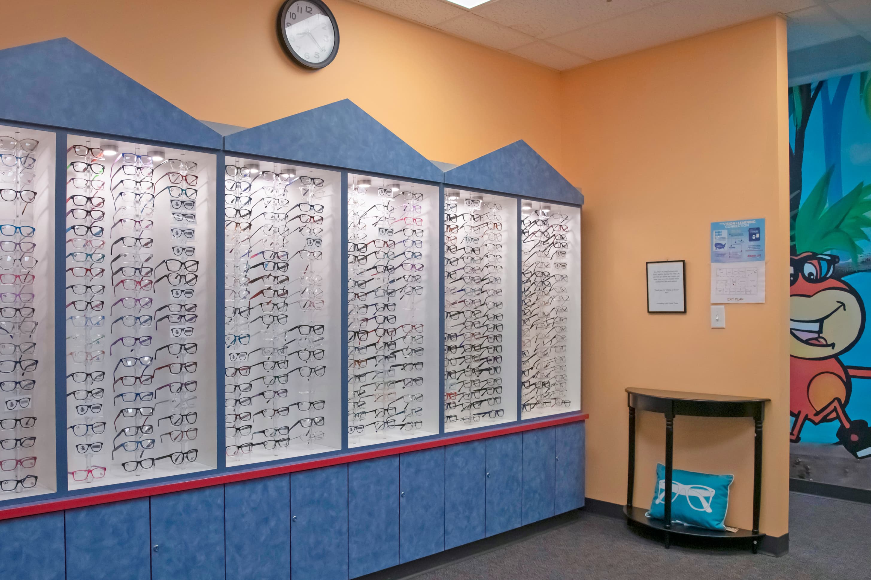 a large display of children's glasses and frames