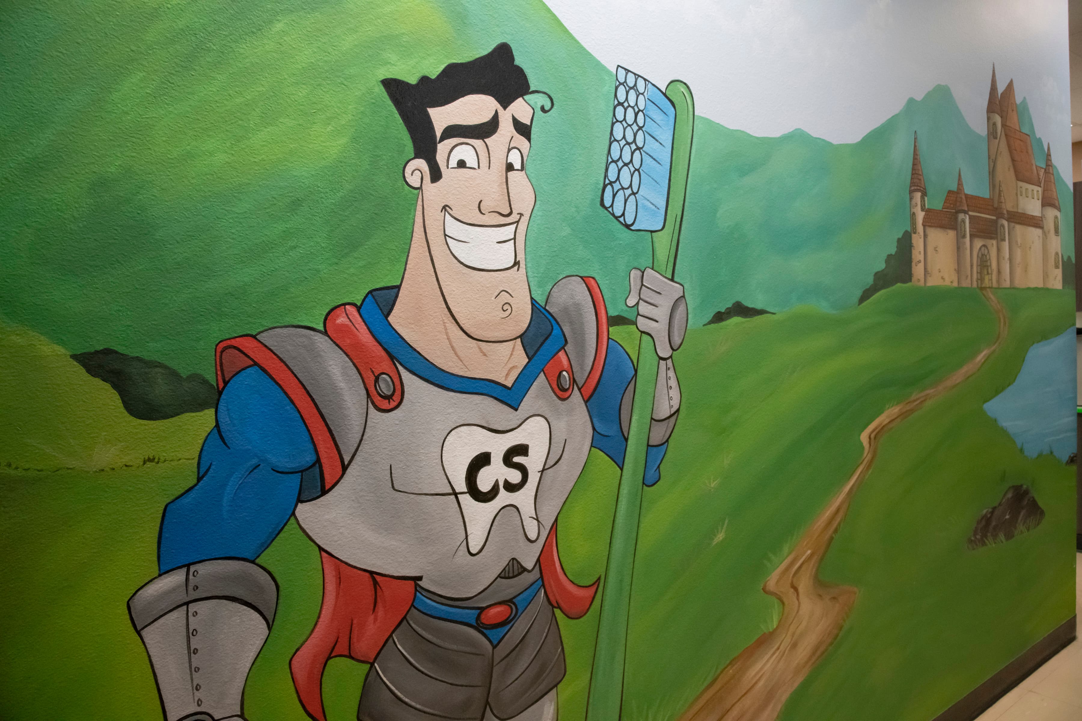 mural of Captain Smiles holding a kid's toothbrush