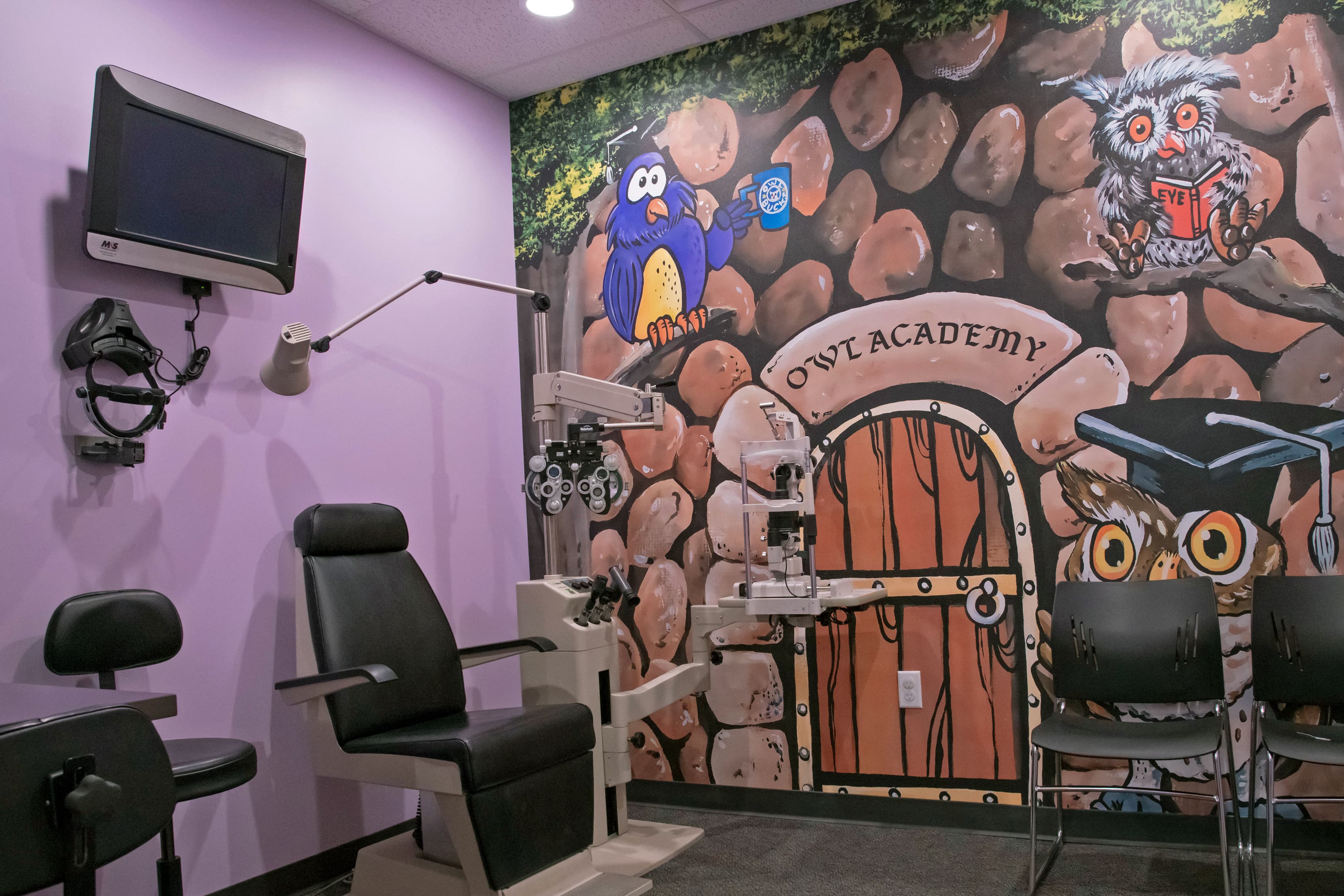 vision eye exam room with a large mural on the wall