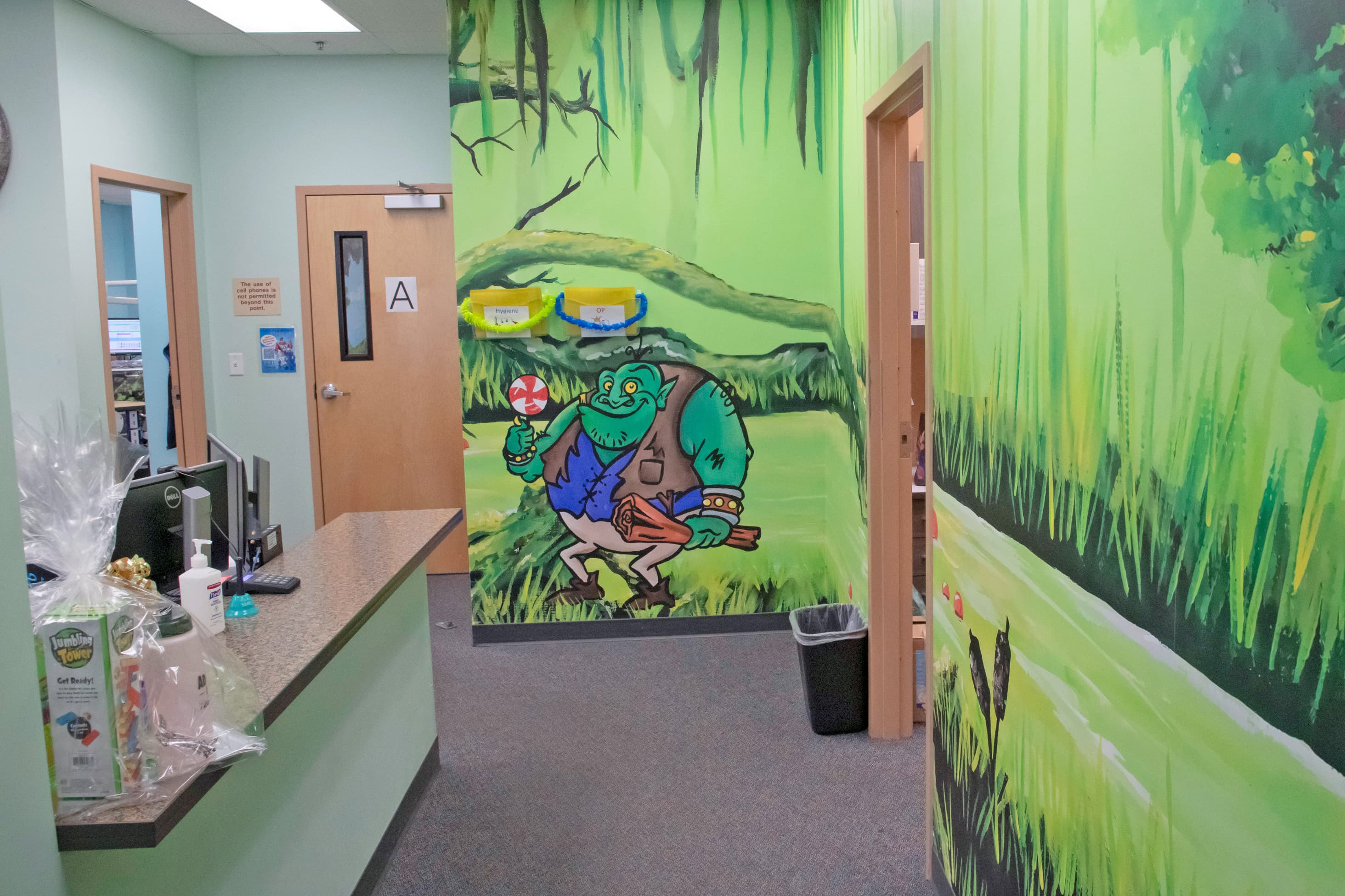 Hallway with colorful mural of an ogre