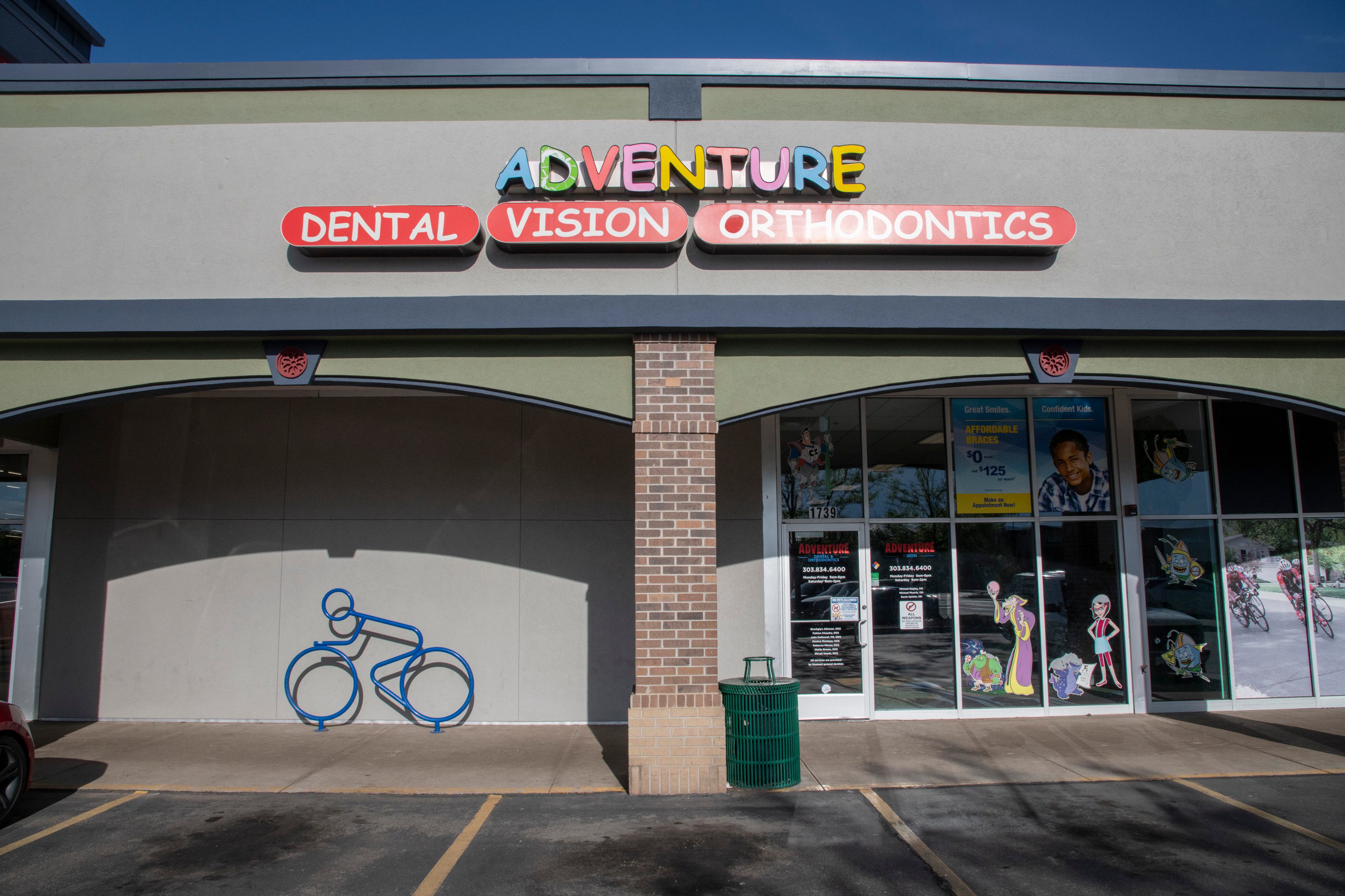 exterior photo of office with a sign that says Adventure Dental Vision and Orthodontics