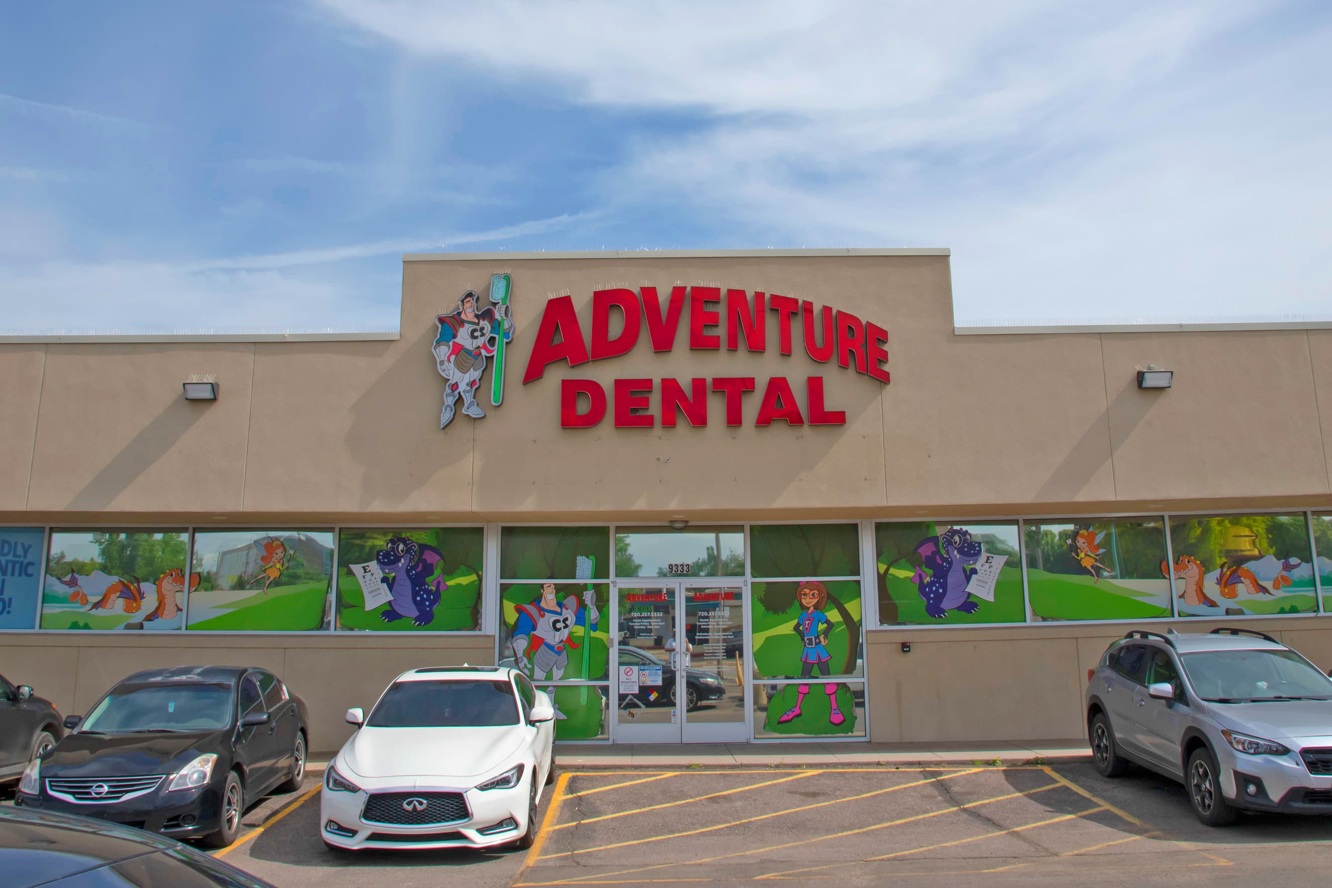 building exterior with colorful graphics on the windows and a sign that says Adventure Dental Aurora