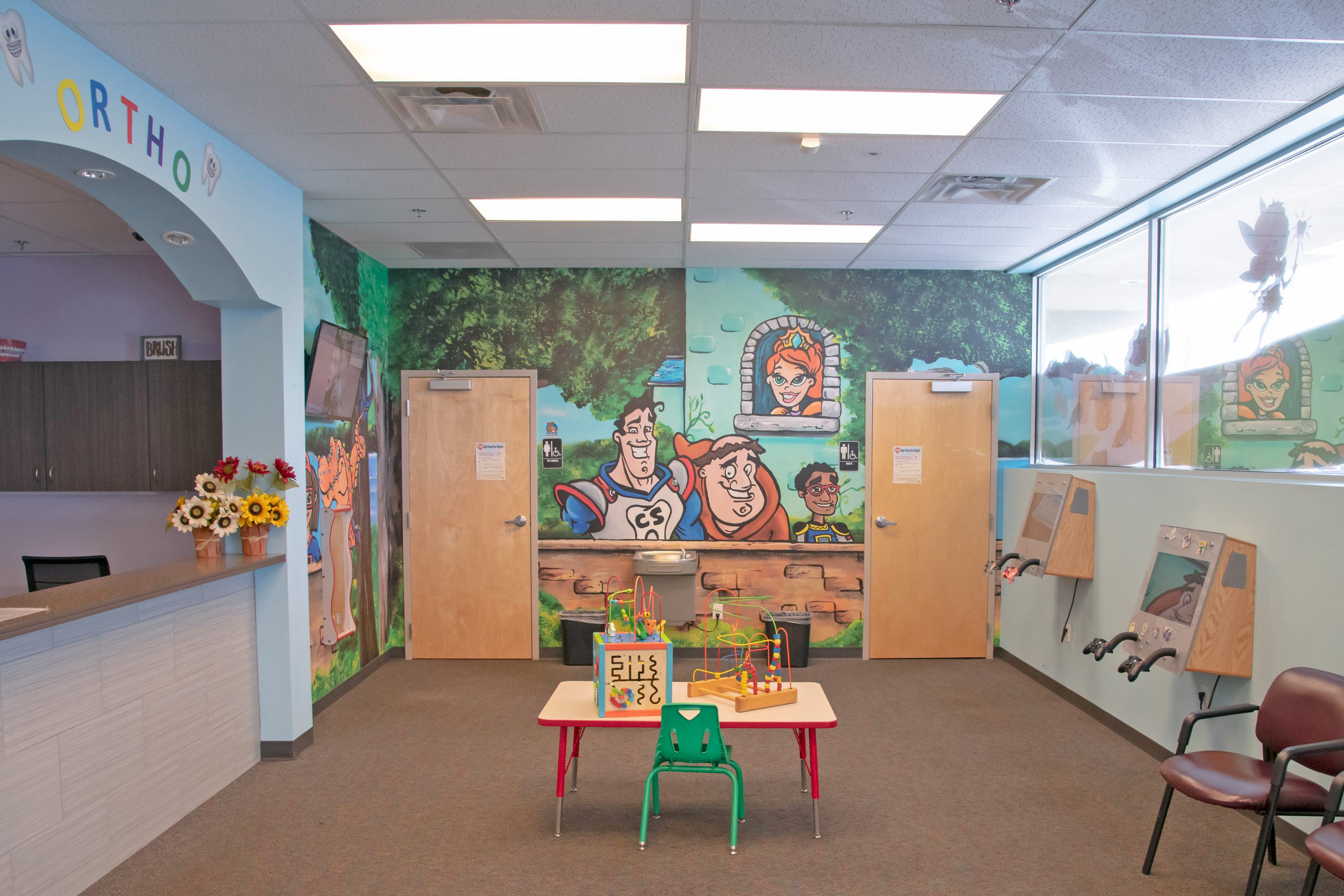 kid's dental office with a small table with toys on it