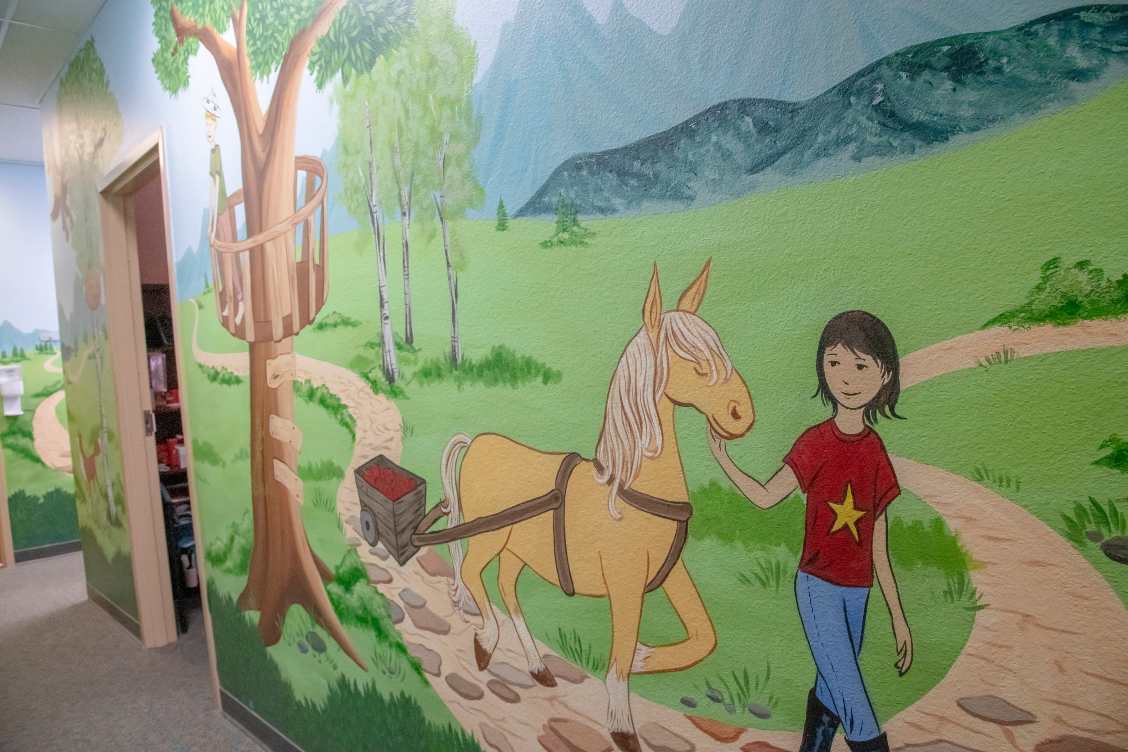 wall mural of a girl walking with a brown horse
