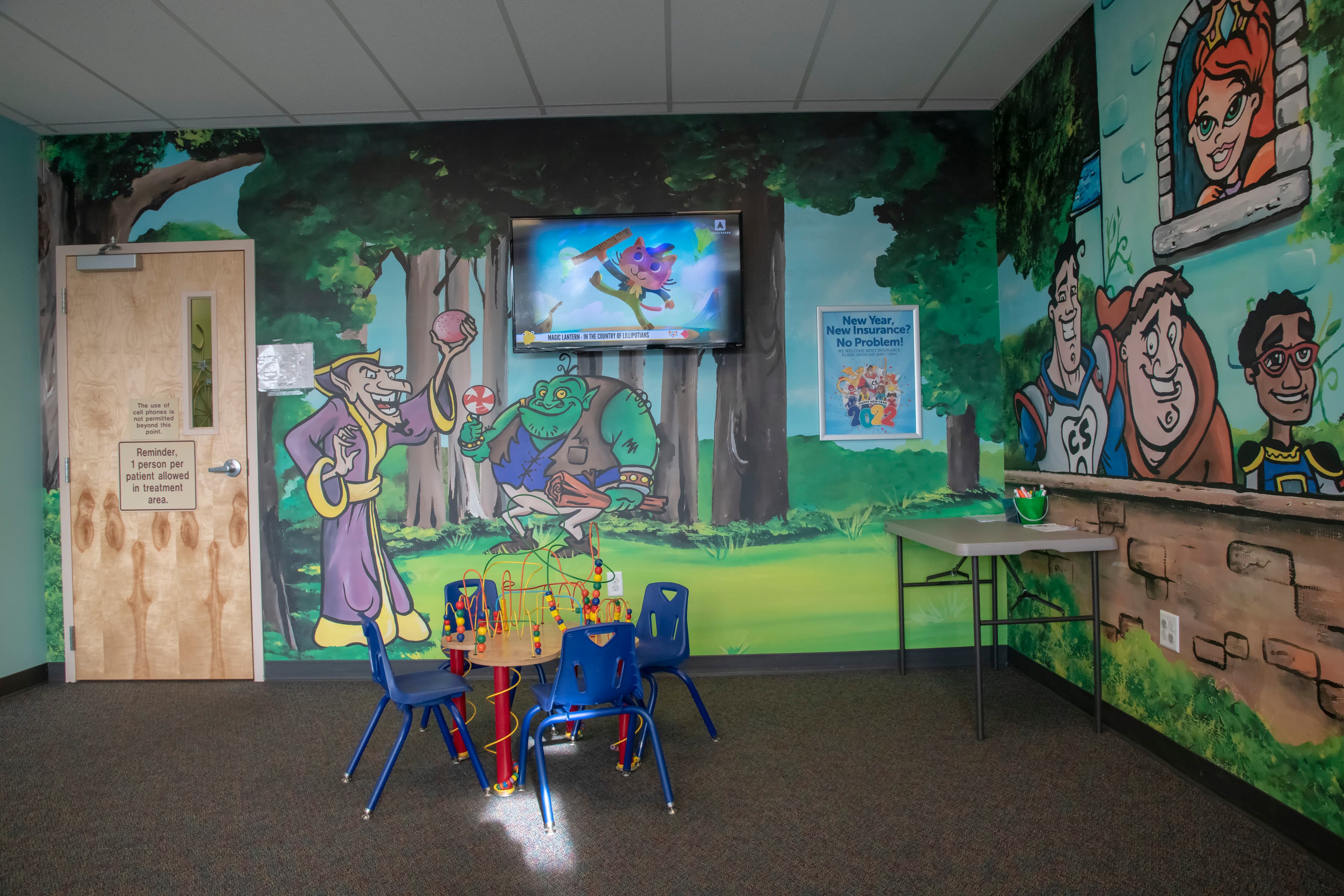 play area for children with colorful murals on the wall