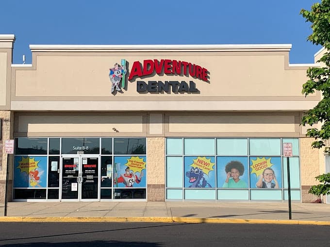 Exterior office of Adventure Dental in Washington D.C. with sign above the office entrance