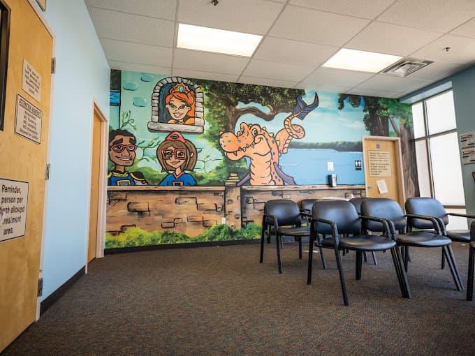 pediatric dental waiting room with colorful wall murals
