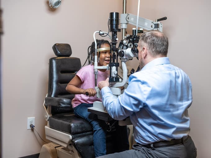 Child receiving a vision exam from a skilled optometrist