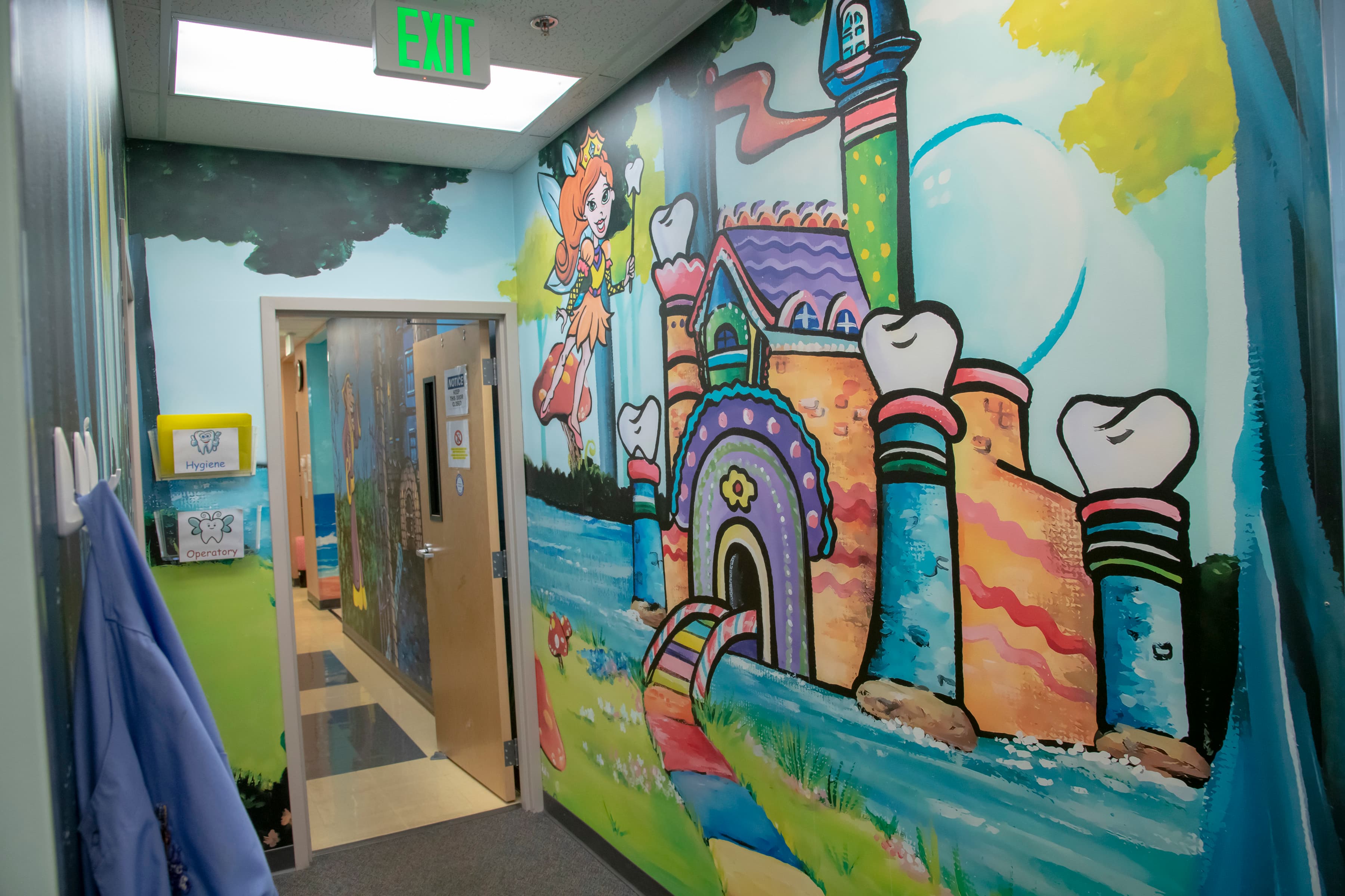 hallway with wall graphic of a cartoon castle